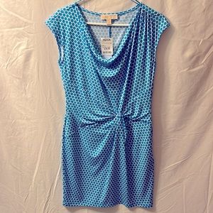 This is a MICHAEL Michael Kors white dress with blue polkadots.